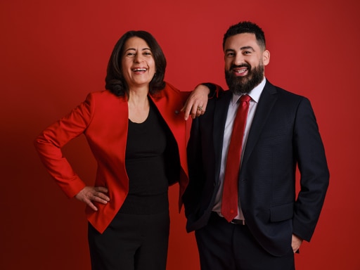 Two home lending executives smiling at the camera