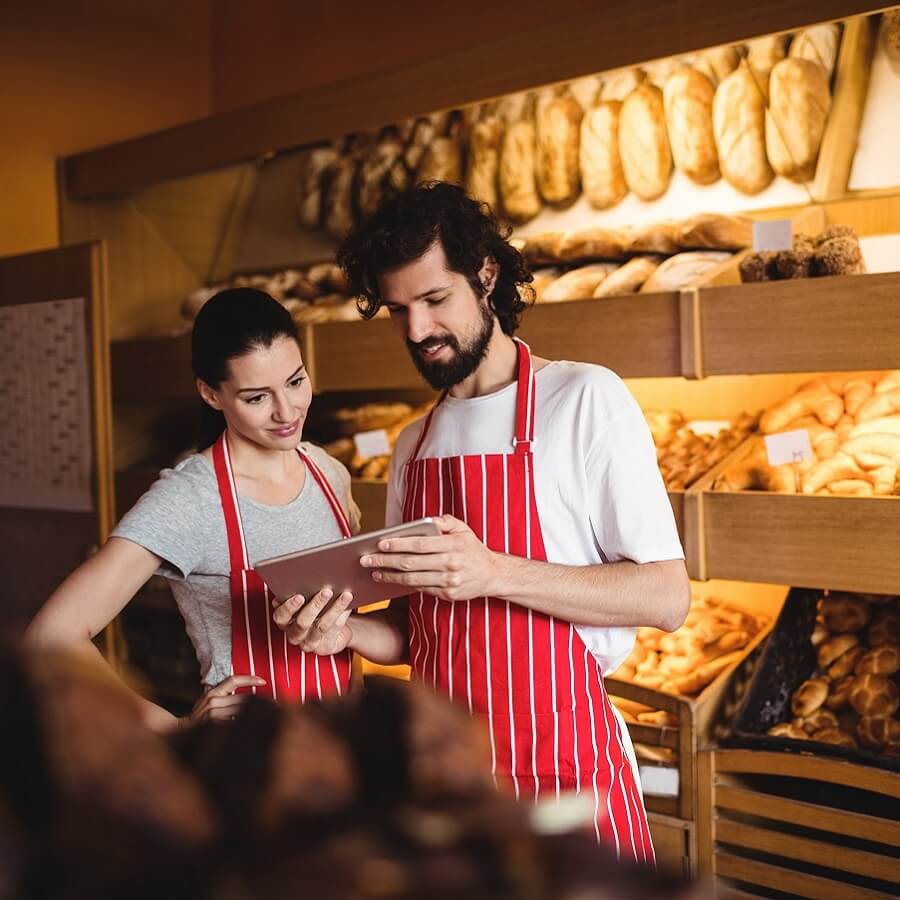 Couple using digital tablet