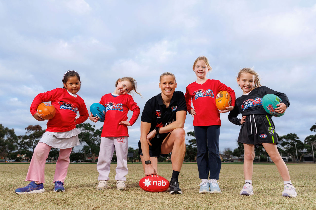 All Stars team member Katie Brennan with NAB AFL Auskickers