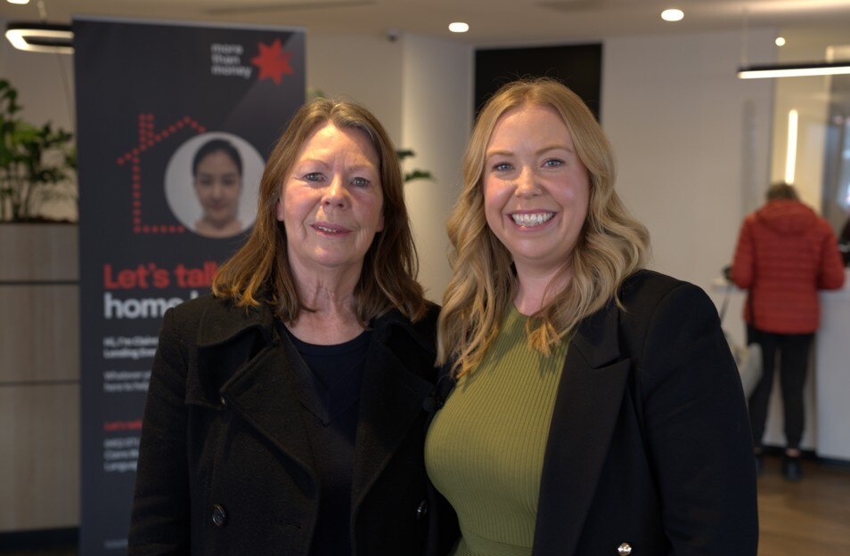 two women smiling at camera
